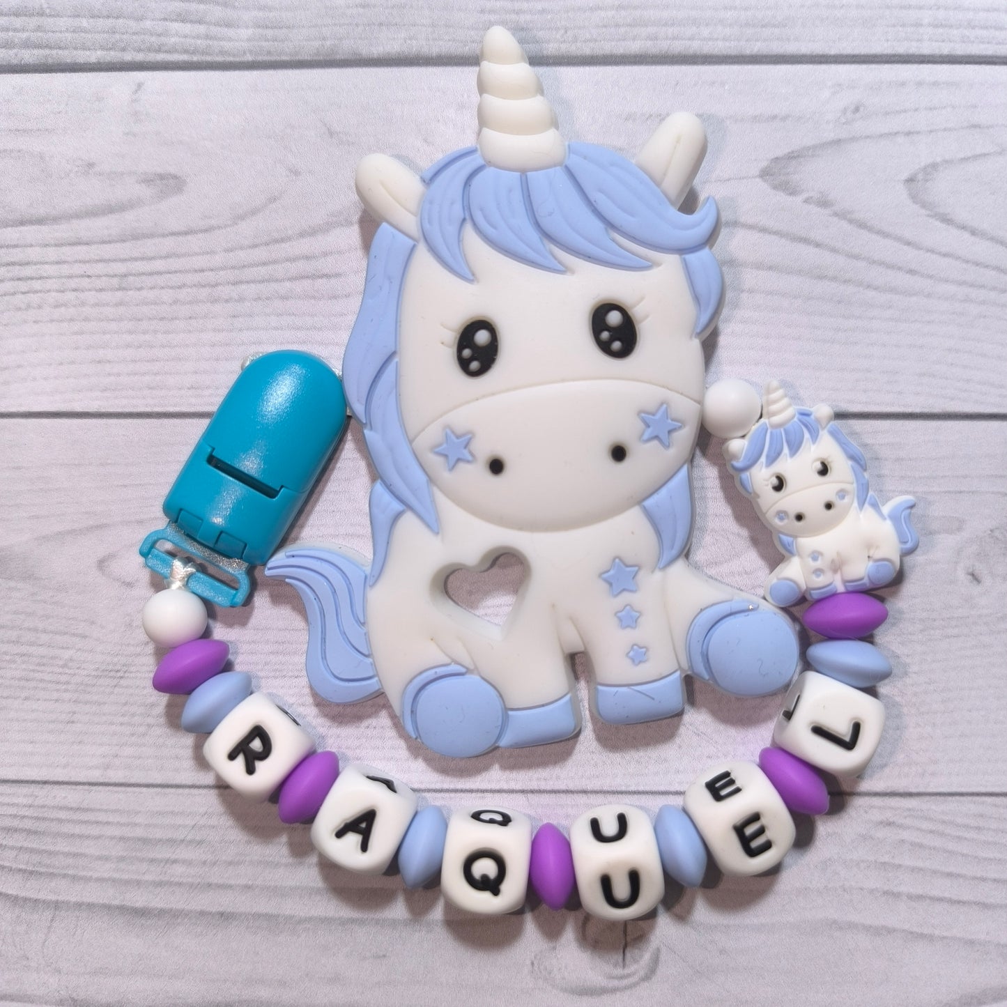 Chupetero + mordedor de Unicornio azul con nombre.